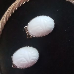 Vintage white cabochon scarab clip on earrings in gold tone.